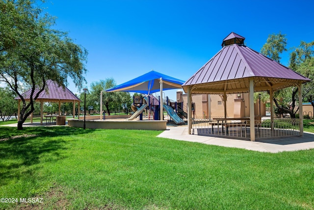 view of jungle gym featuring a lawn and a gazebo