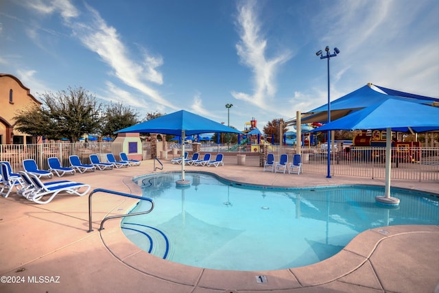 view of swimming pool with a patio