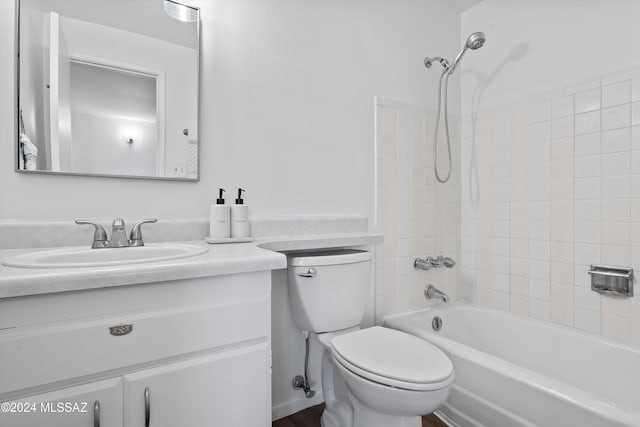full bathroom with toilet, vanity, and tiled shower / bath