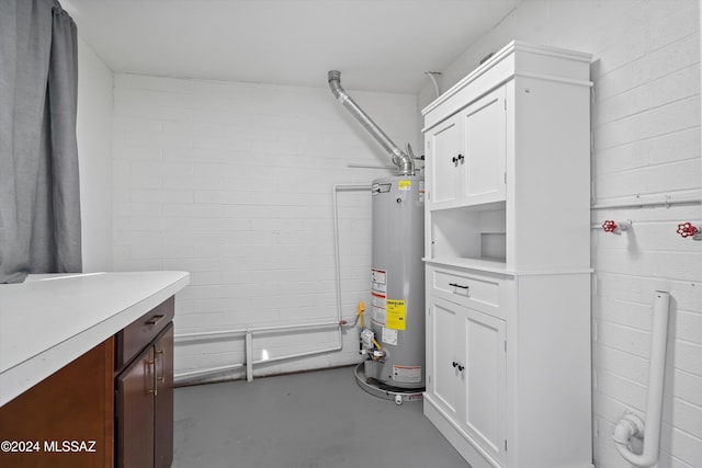 utility room featuring gas water heater