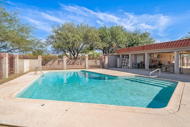 view of swimming pool with a patio area