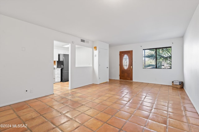 interior space with light tile patterned floors
