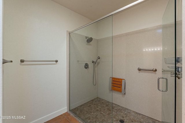 bathroom with a shower stall