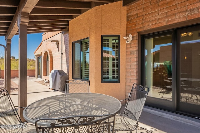 view of patio / terrace featuring a grill and outdoor dining space