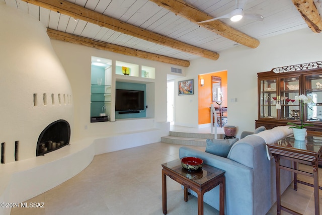 living room featuring beam ceiling, ceiling fan, and wood ceiling