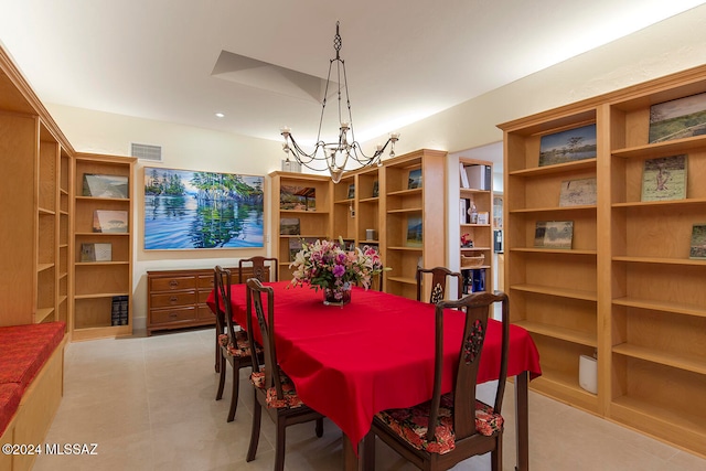 dining space with an inviting chandelier