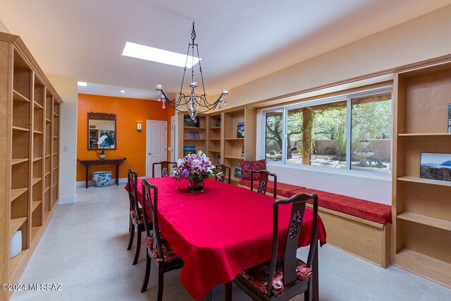 dining area with an inviting chandelier