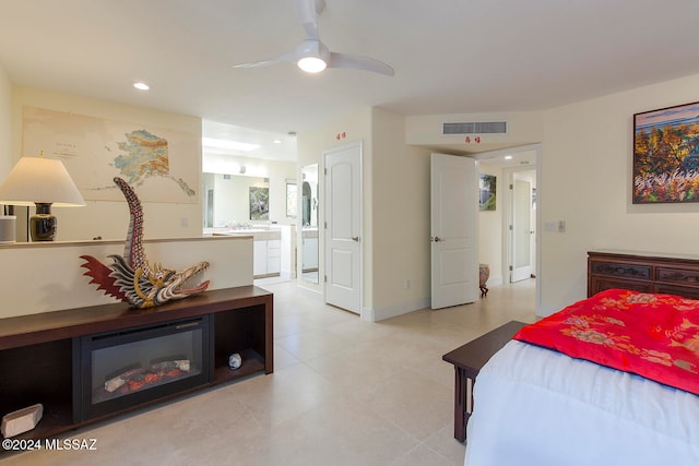 bedroom featuring ceiling fan and ensuite bath