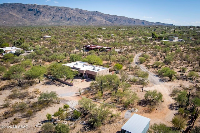 birds eye view of property featuring a mountain view