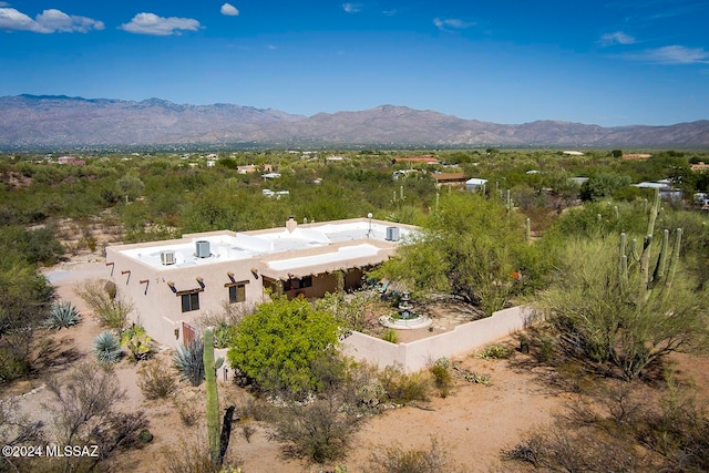 birds eye view of property with a mountain view