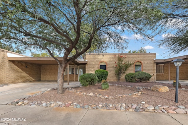 ranch-style home with a carport