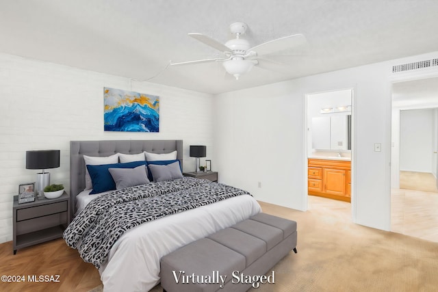 bedroom with ceiling fan and ensuite bathroom