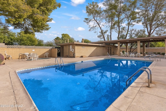 view of pool featuring a patio area