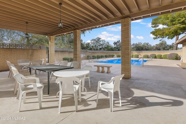 view of patio / terrace featuring a community pool