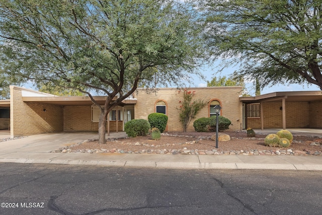 view of front of home featuring a carport