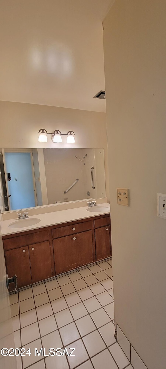 bathroom with vanity and tile patterned flooring