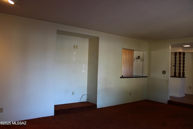 spare room featuring a textured ceiling