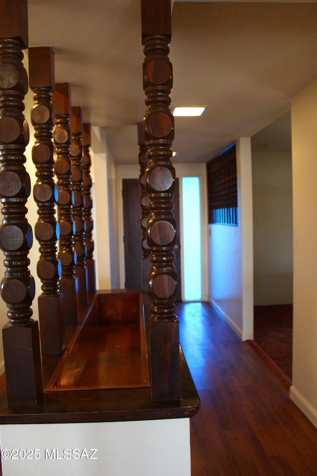 corridor featuring hardwood / wood-style floors