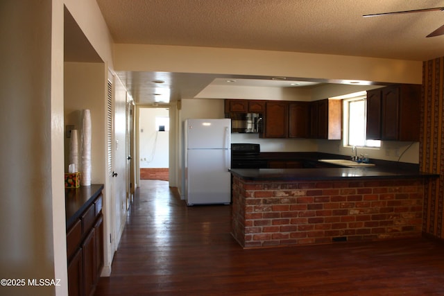 kitchen with dark hardwood / wood-style flooring, white fridge, electric stove, sink, and kitchen peninsula