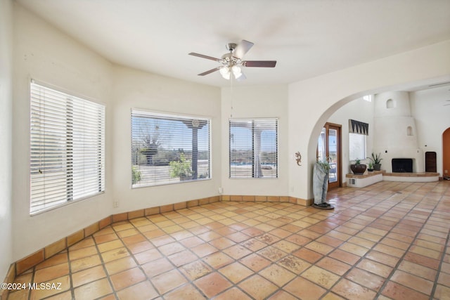 interior space featuring tile patterned floors and ceiling fan