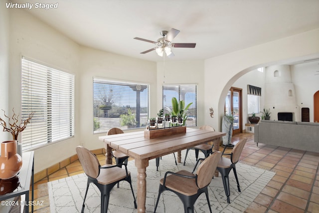 dining space featuring tile patterned flooring and ceiling fan