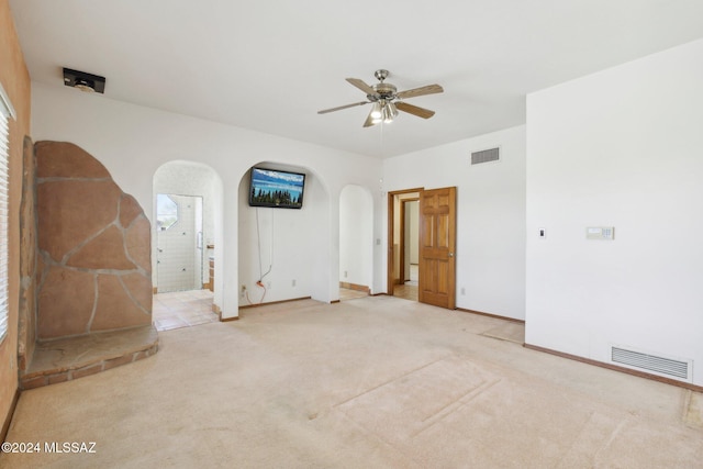 spare room featuring carpet flooring and ceiling fan