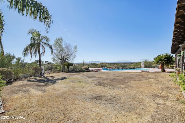 view of yard featuring a fenced in pool