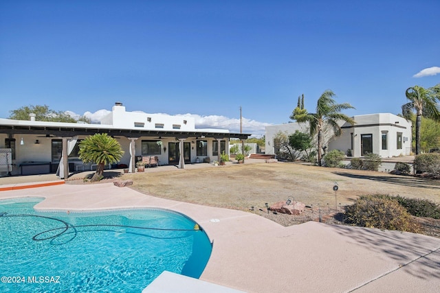 view of swimming pool with a patio