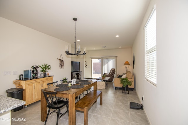 dining room featuring light tile patterned floors, baseboards, a chandelier, and recessed lighting