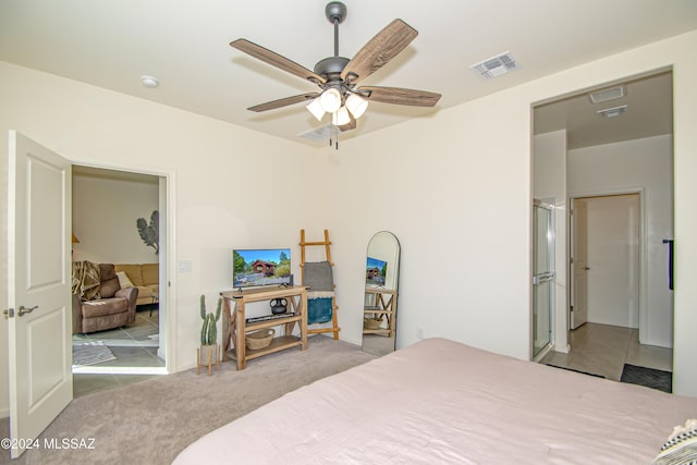 bedroom with ceiling fan, carpet floors, and visible vents