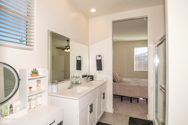 ensuite bathroom featuring ensuite bath, a shower stall, and a sink