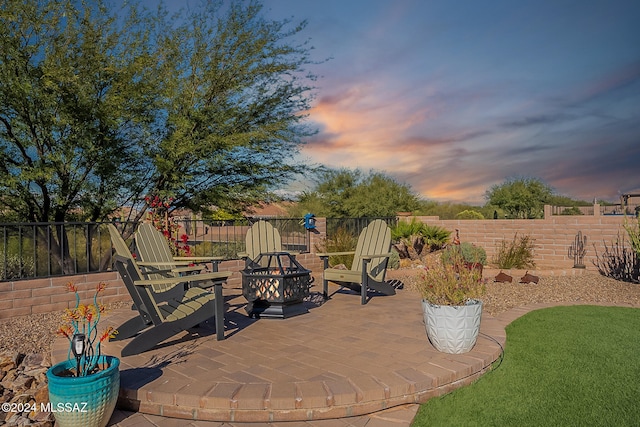 patio terrace at dusk with an outdoor fire pit