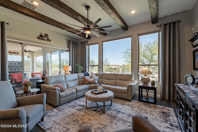 living room featuring ceiling fan, dark hardwood / wood-style floors, and beam ceiling