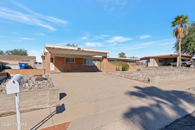 single story home with a carport