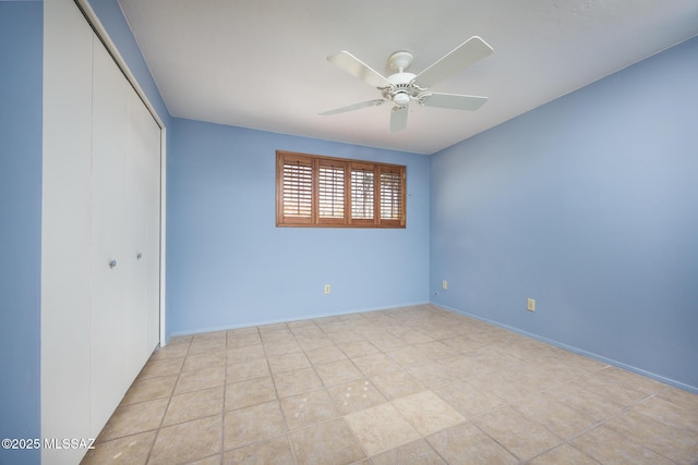 unfurnished bedroom featuring a closet and ceiling fan