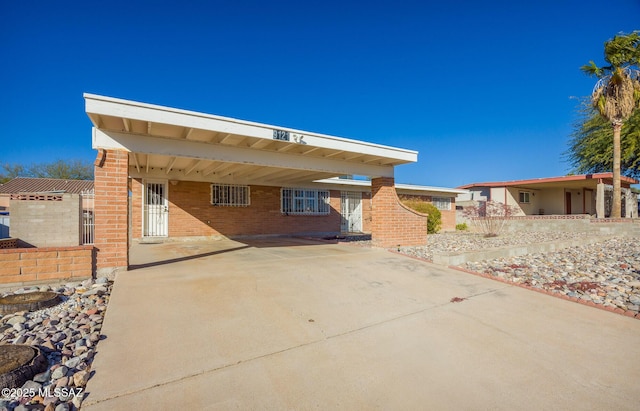 view of front of home featuring a carport