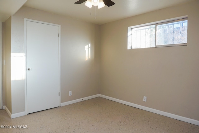 unfurnished bedroom featuring ceiling fan