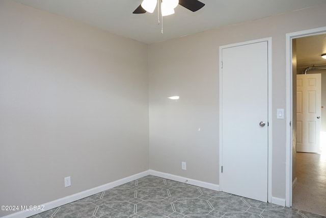 unfurnished room with ceiling fan