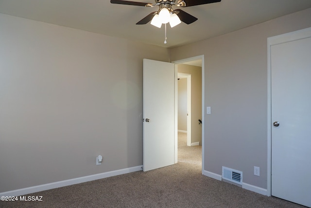 unfurnished bedroom with carpet and ceiling fan