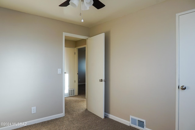 unfurnished bedroom with ceiling fan and carpet floors