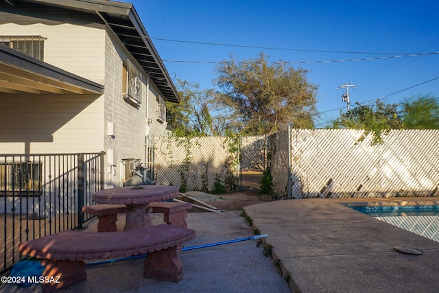 view of patio / terrace featuring a pool