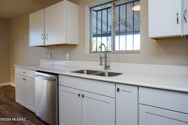 kitchen featuring dishwasher, white cabinetry, dark wood-type flooring, and sink