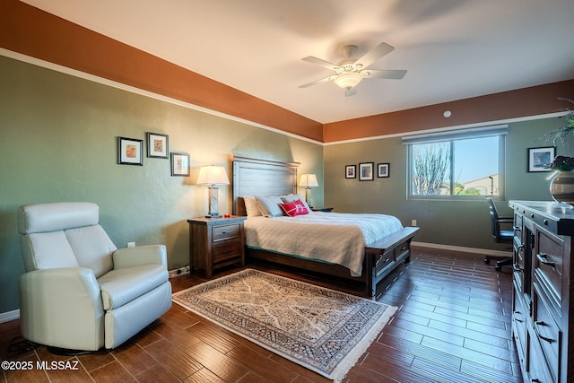 bedroom featuring baseboards, a ceiling fan, and dark wood-type flooring
