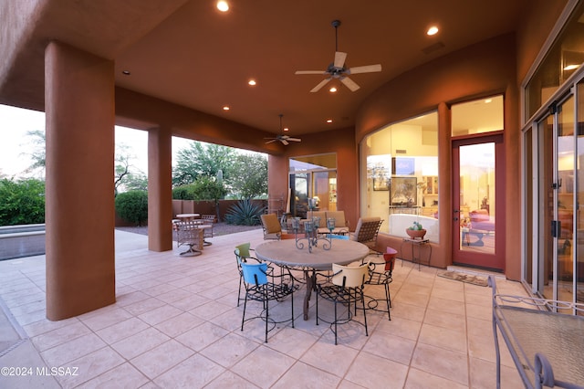 view of patio / terrace featuring outdoor dining space, ceiling fan, fence, and visible vents