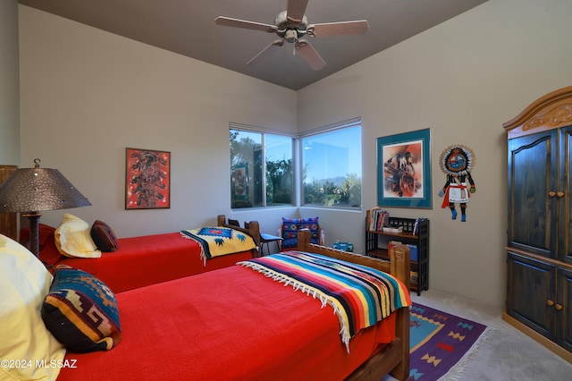 bedroom featuring light colored carpet, ceiling fan, and vaulted ceiling