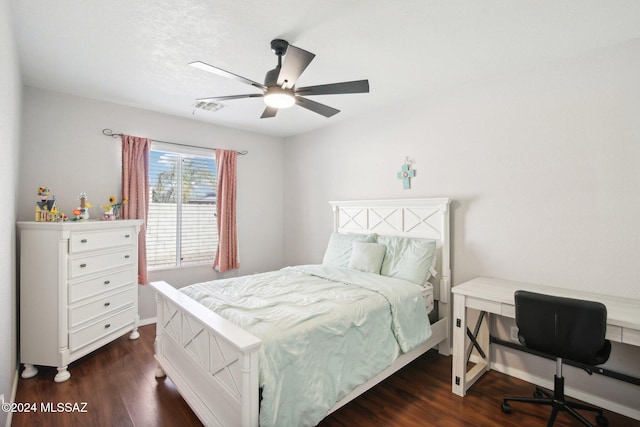 bedroom featuring ceiling fan and dark hardwood / wood-style flooring