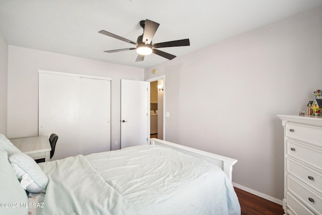 bedroom with a closet, ceiling fan, and dark wood-type flooring