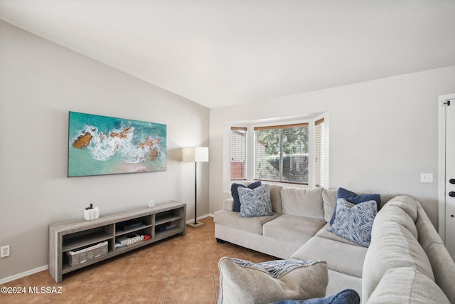 tiled living room with lofted ceiling