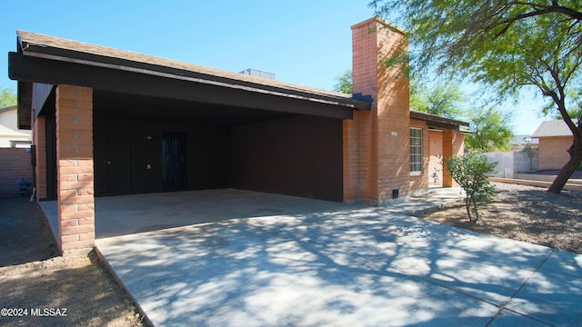 exterior space with a carport