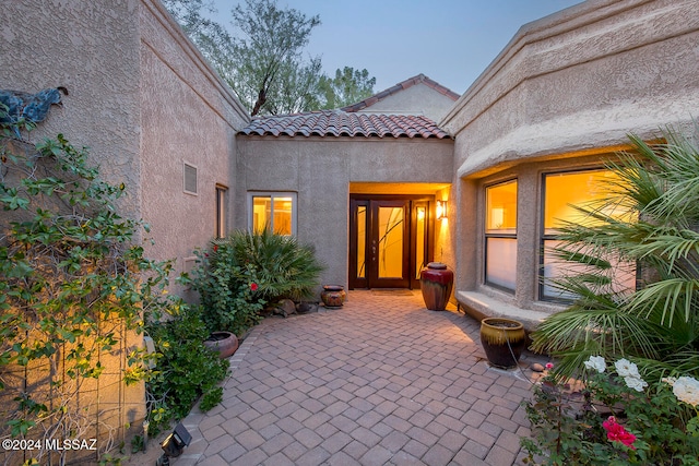 view of patio terrace at dusk